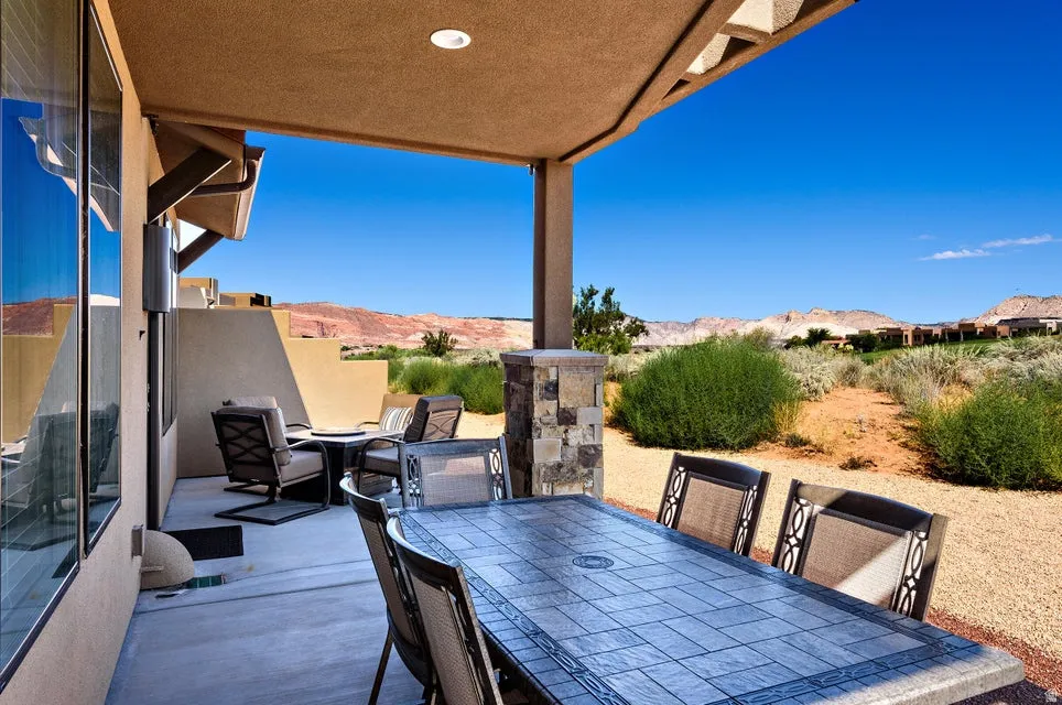 Expansive covered patio featuring a textured ceiling with recessed lighting