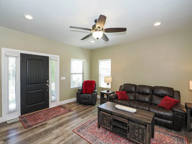 Entryway featuring a dark paneled door with sidelights