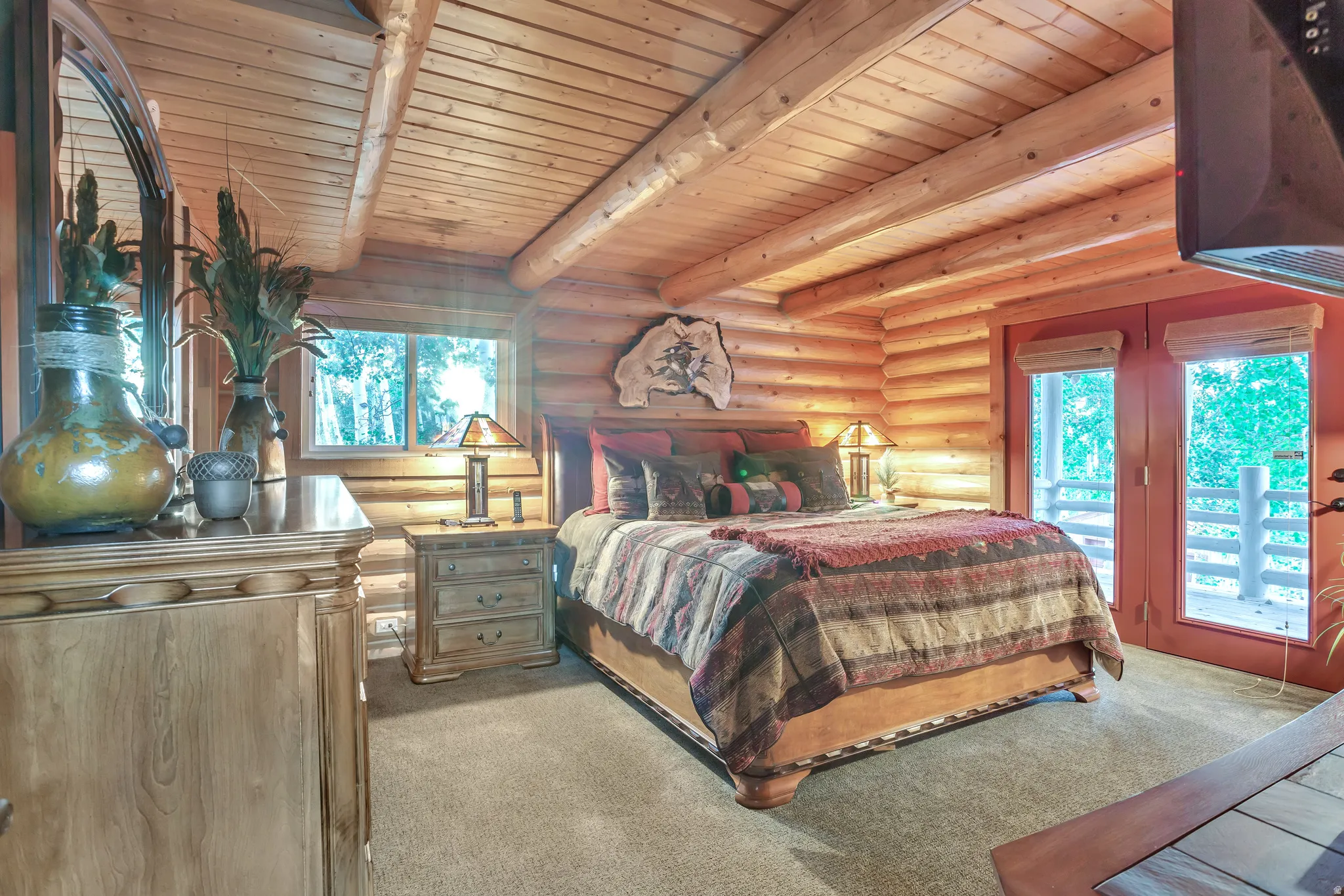 Log cabin interior featuring robust log walls and a matching log ceiling