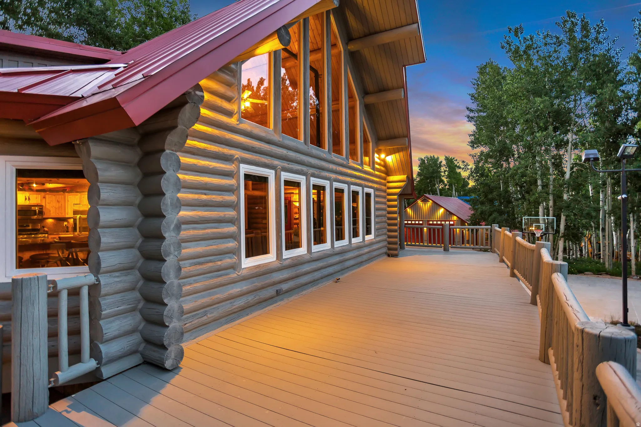 Expansive outdoor deck featuring log railings