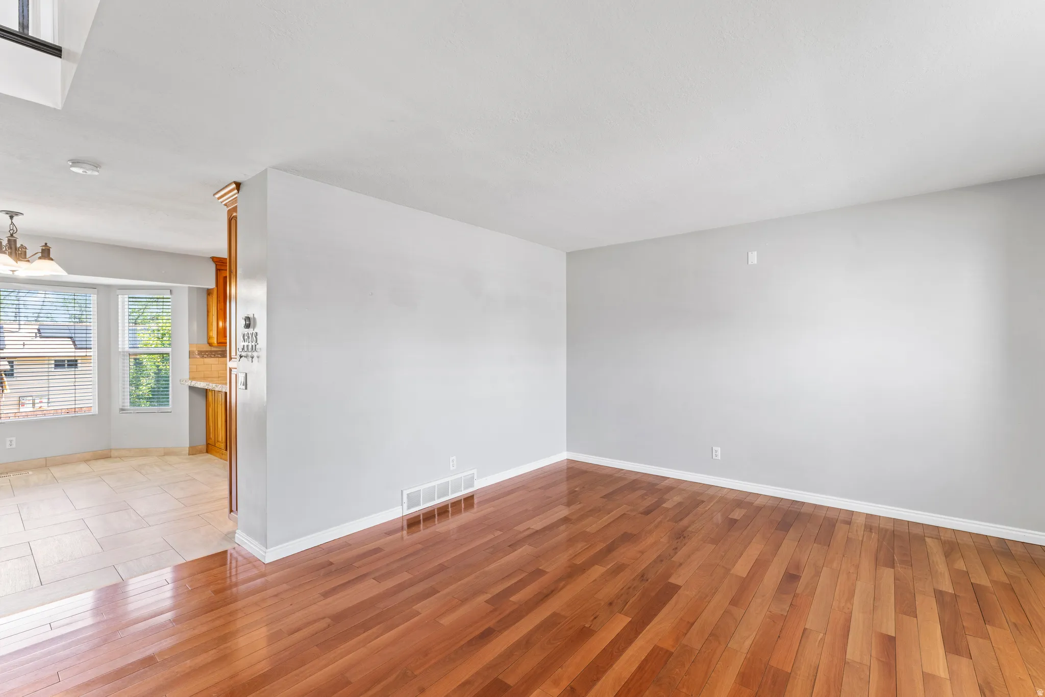 Hardwood flooring extending throughout the main living space