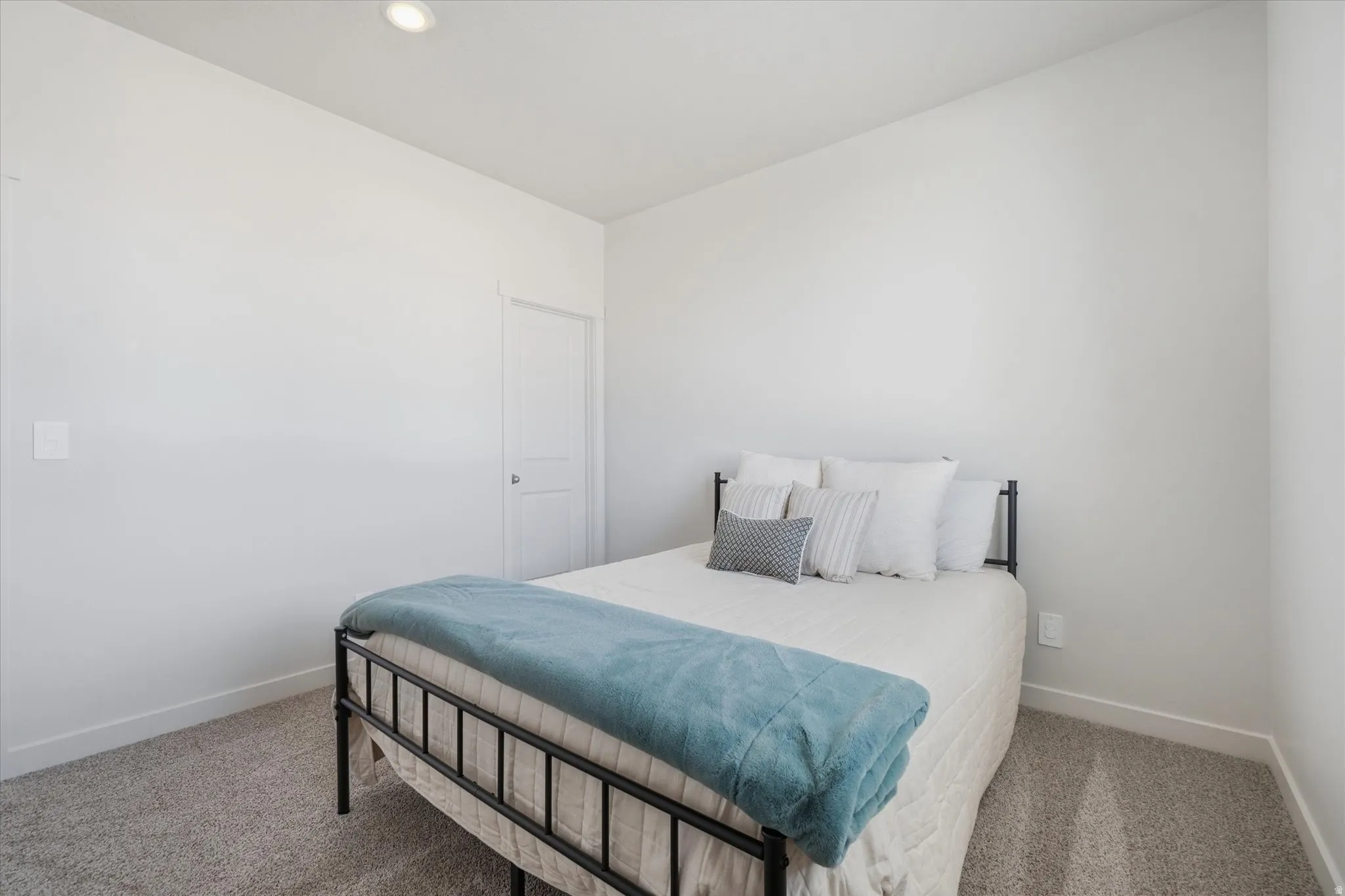 Bedroom featuring recessed lighting, a neutral color palette, grey carpet, and white baseboards