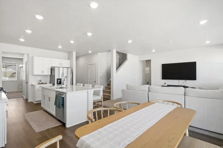 Open-concept living area with wood-finish flooring