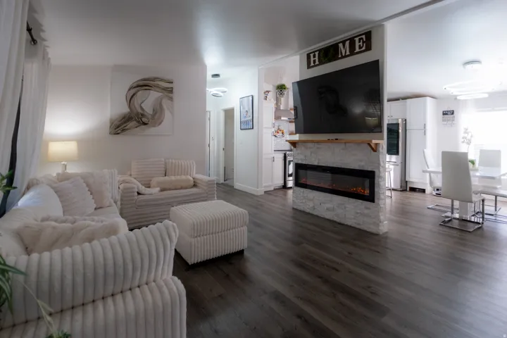 Open-concept living space featuring wood-finish flooring