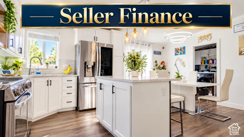 Kitchen featuring white cabinetry, an island with stone-finish countertops, stainless steel appliances, and wood-finish flooring