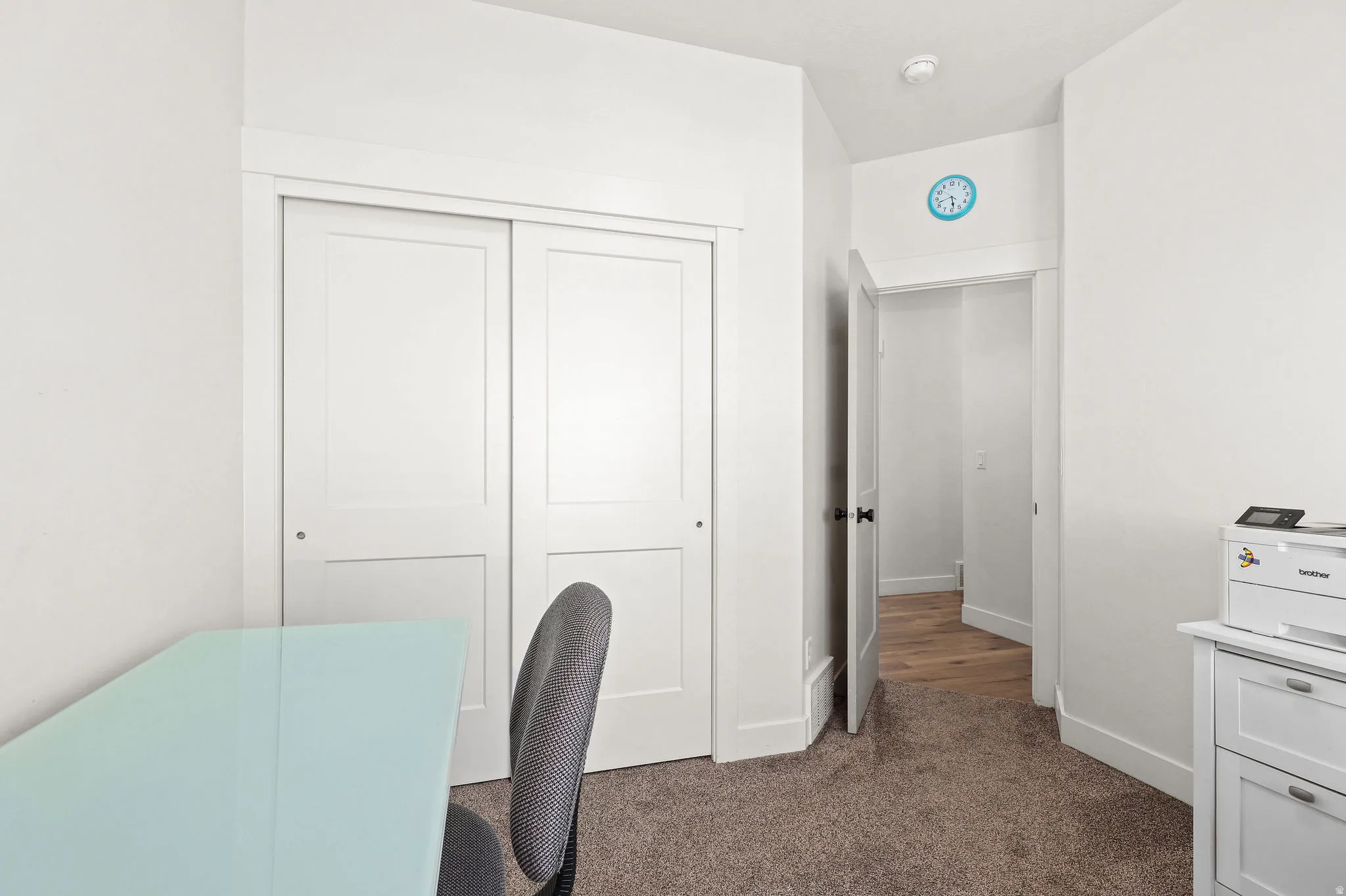 Neutral-toned carpeting paired with white walls