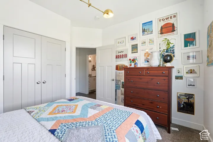 White shaker-style bi-fold closet doors with round chrome hardware