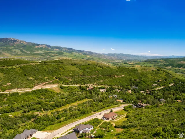 Expansive mountain scenery with verdant hillsides