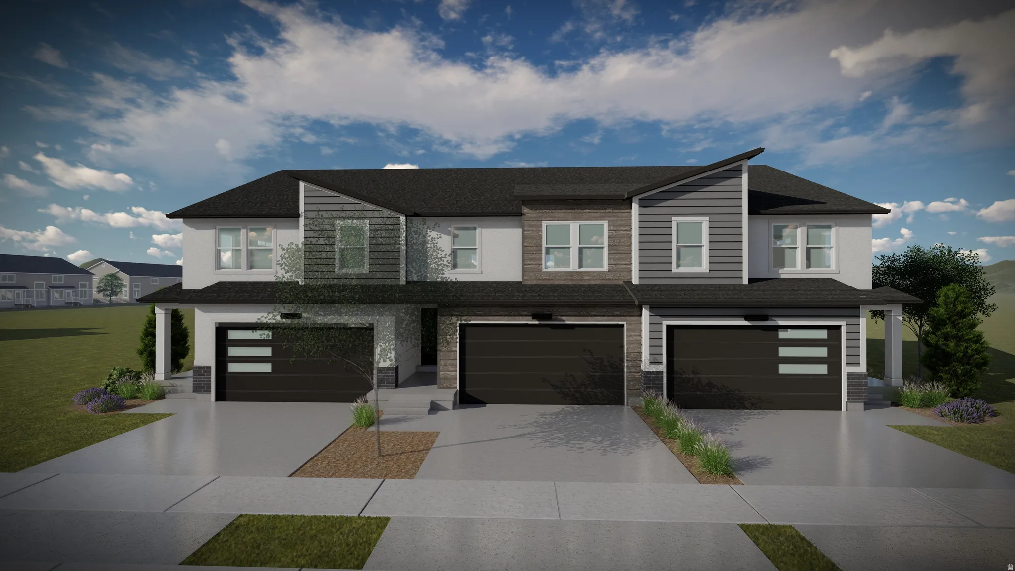 Modern townhome complex featuring a multi-textured facade with horizontal siding and stone accents