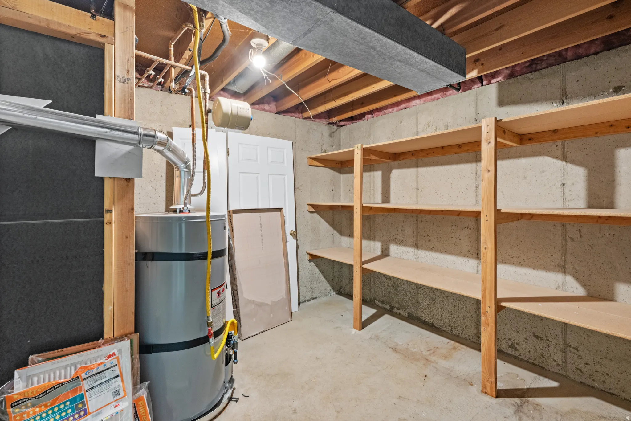 Unfinished basement area featuring concrete walls and flooring
