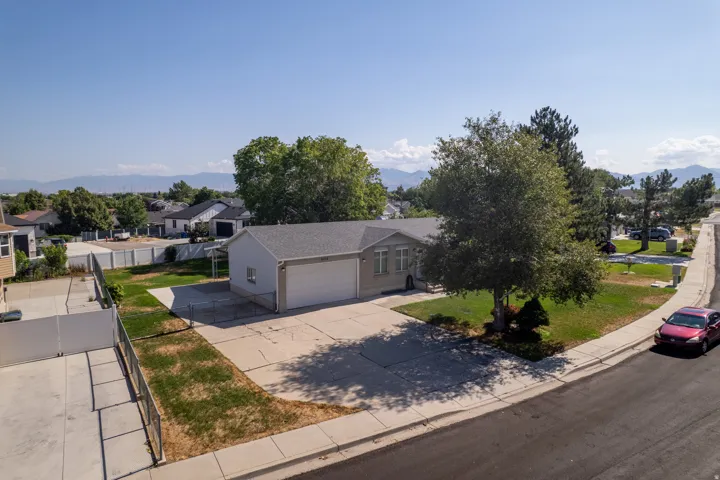Single-story residence featuring a two-car garage and a paved driveway