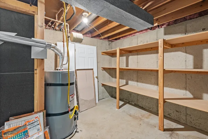 Unfinished basement area featuring concrete walls and flooring