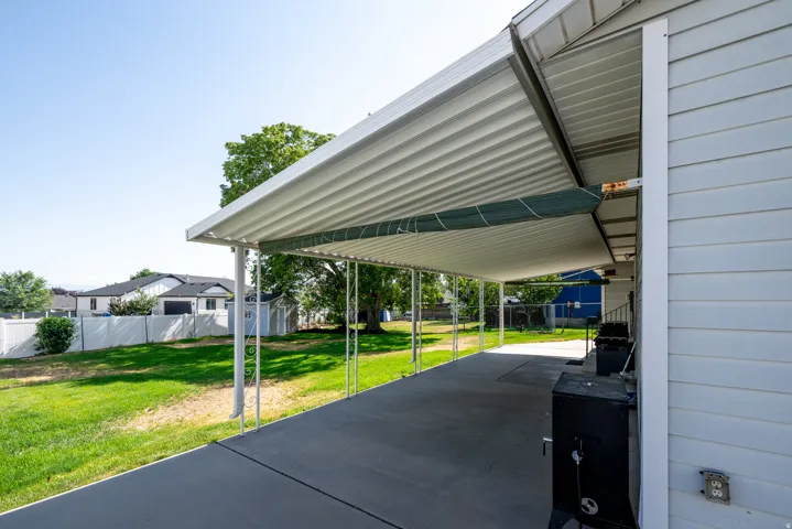 Covered patio area featuring a concrete surface