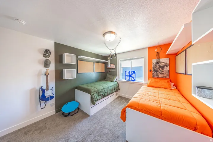 Room featuring neutral carpeting and a ceiling light fixture