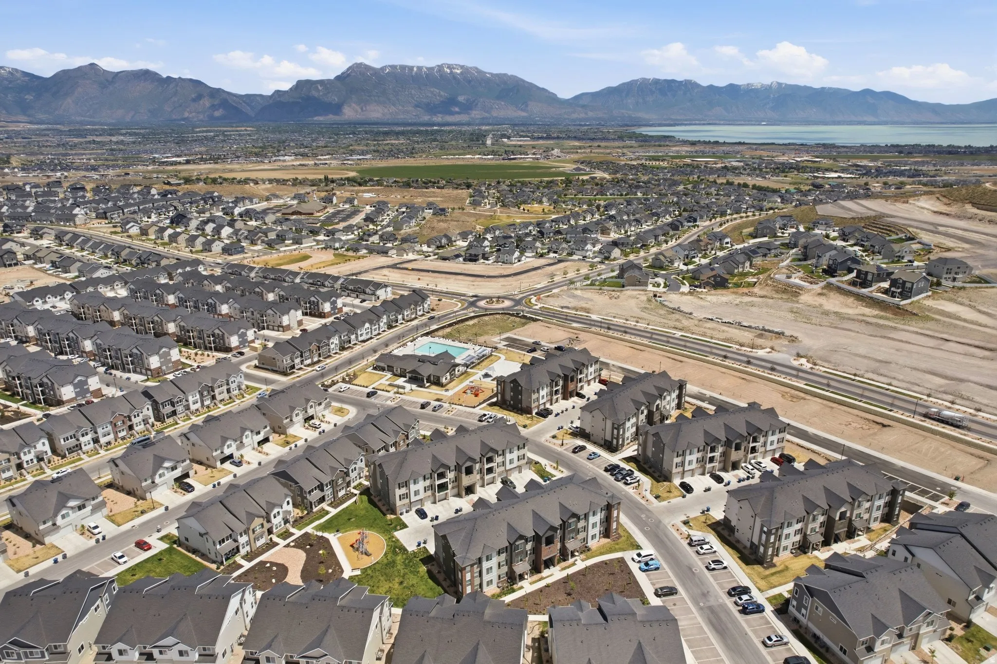Expansive residential development featuring single-family homes and multi-story apartment buildings