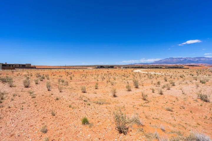 Expansive desert landscape with a clear blue sky