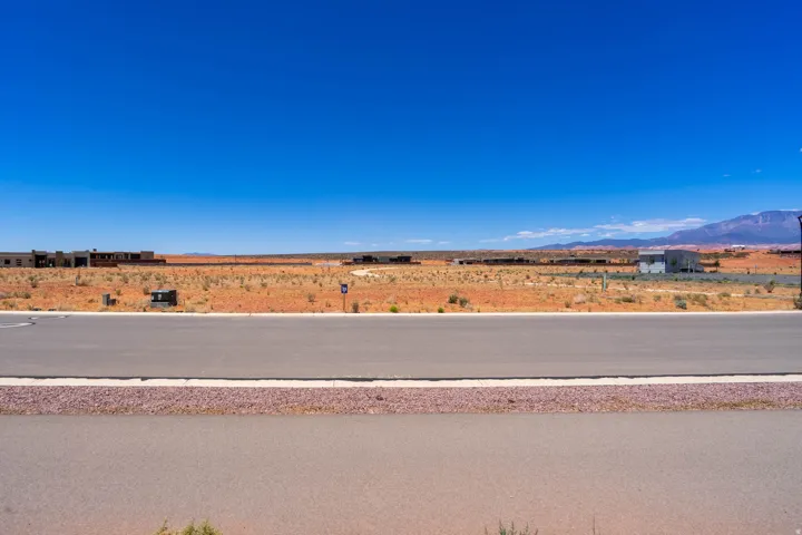 Paved road frontage with a gravel shoulder