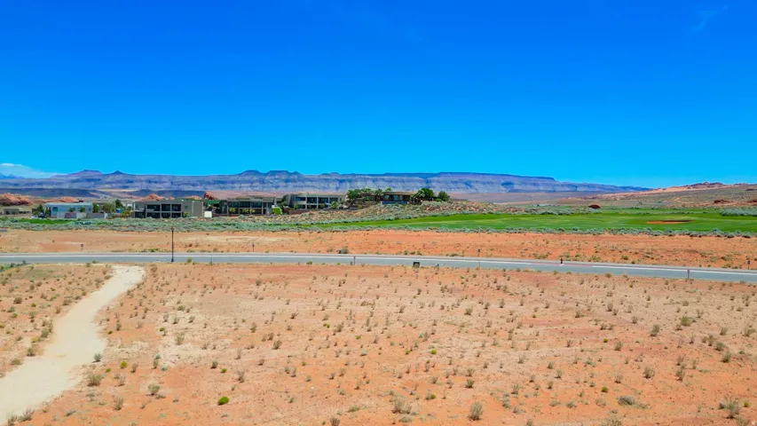 Expansive desert landscape with mountain backdrops