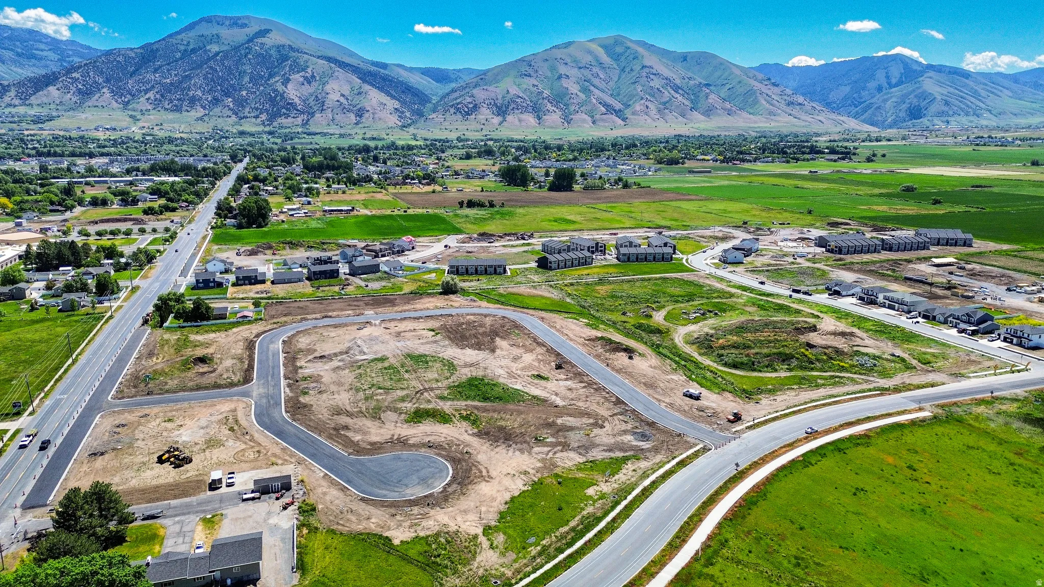 Expansive land parcel featuring new road infrastructure and a cul-de-sac