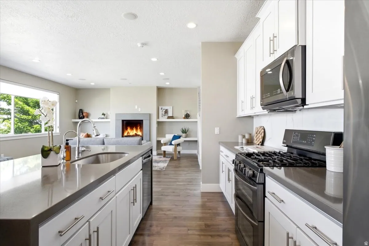 Kitchen island with an undermount sink and a stainless steel faucet