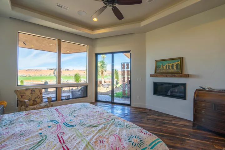 Hardwood-finish flooring complementing a contemporary linear fireplace with a wood mantel
