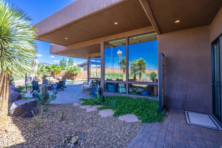 Exterior patio with paver flooring and recessed lighting