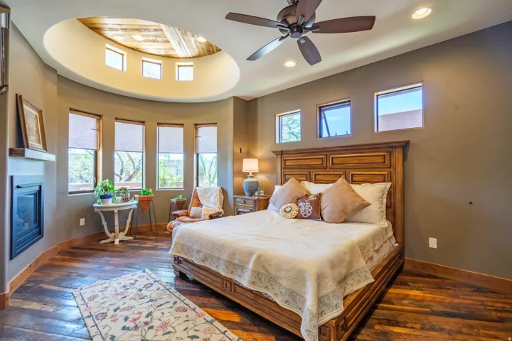 Curved architectural feature with high windows and a circular ceiling inset with wood-finish paneling