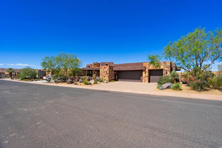Desert-style architecture featuring stone and stucco finishes