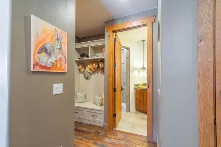 Built-in mudroom bench with drawer storage and upper shelving