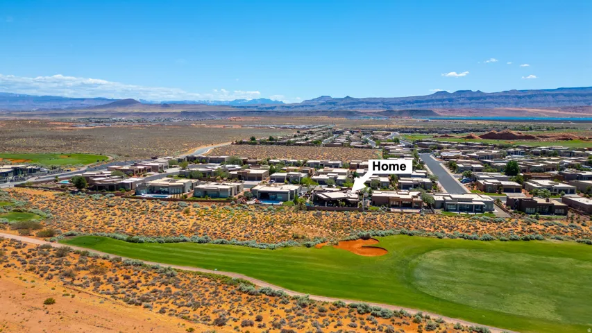 Aerial perspective showcasing a community of homes with golf course frontage