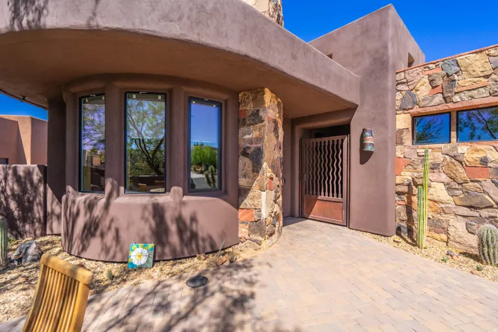 Adobe-style exterior with stone veneer accents