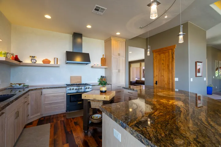 Expansive kitchen island with a polished granite countertop