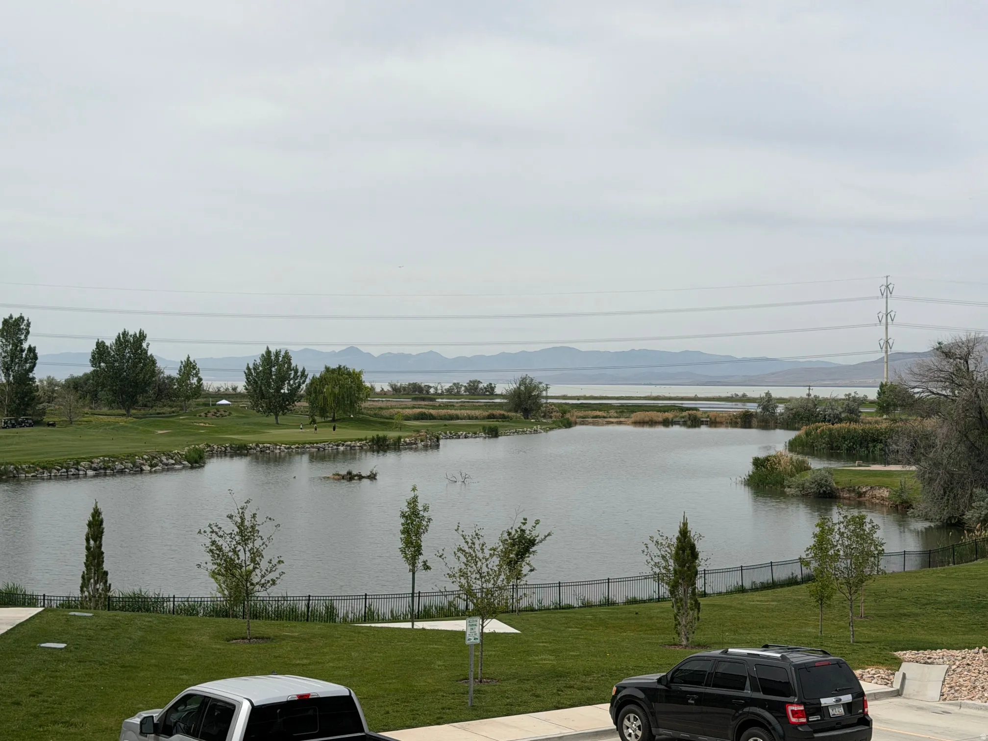 Expansive water feature with surrounding green spaces