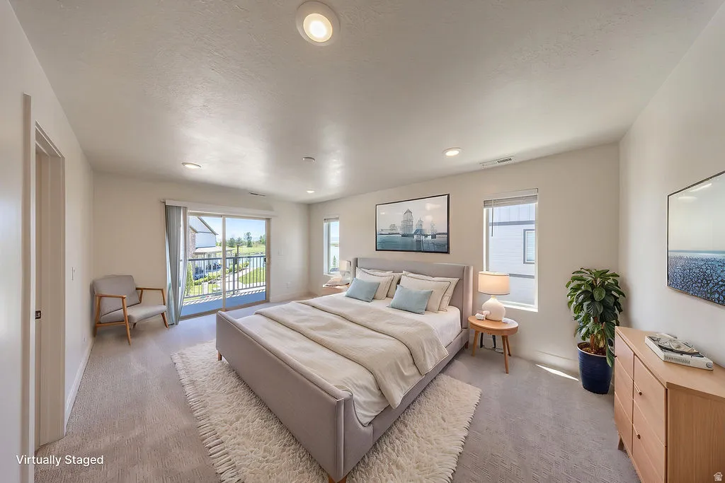 Virtually Staged. Spacious room featuring light-toned carpeting and recessed lighting
