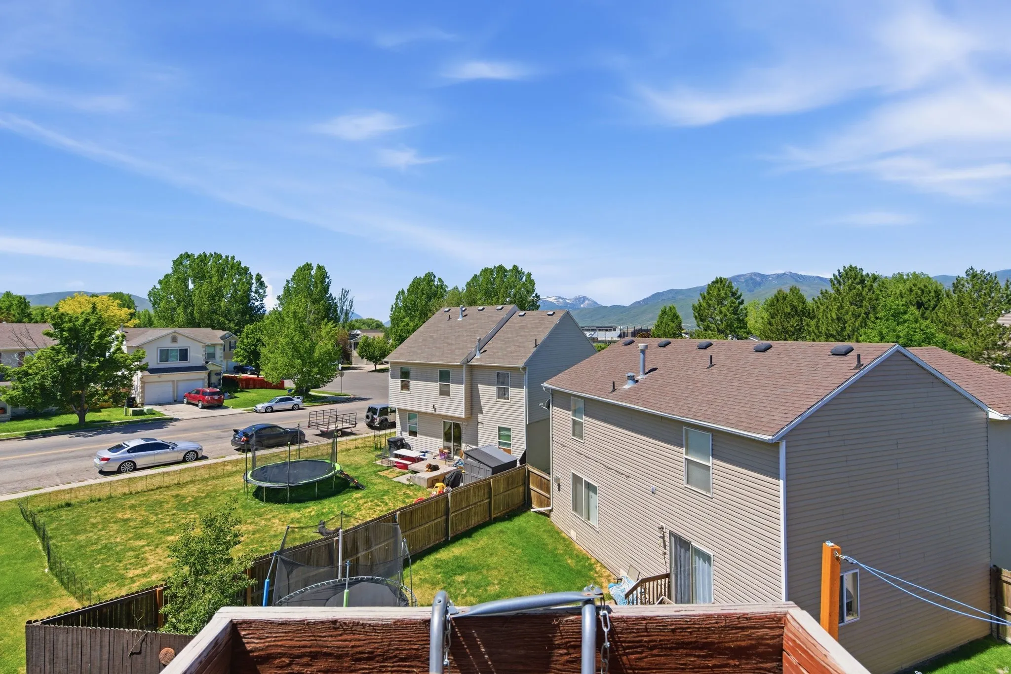 Suburban neighborhood featuring two-story homes with vinyl siding and asphalt shingle roofs
