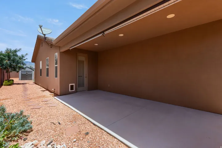 Covered concrete patio with recessed lighting