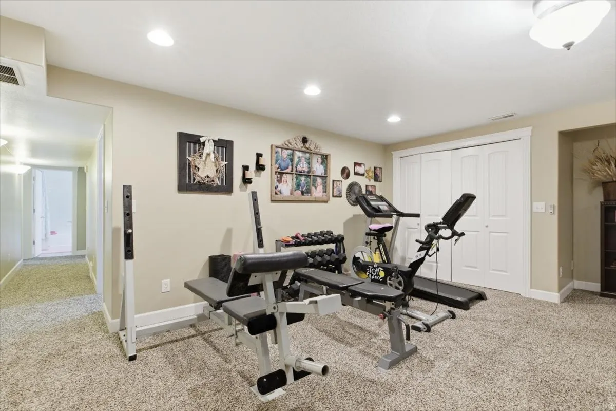Carpeted room featuring recessed lighting and neutral wall tones