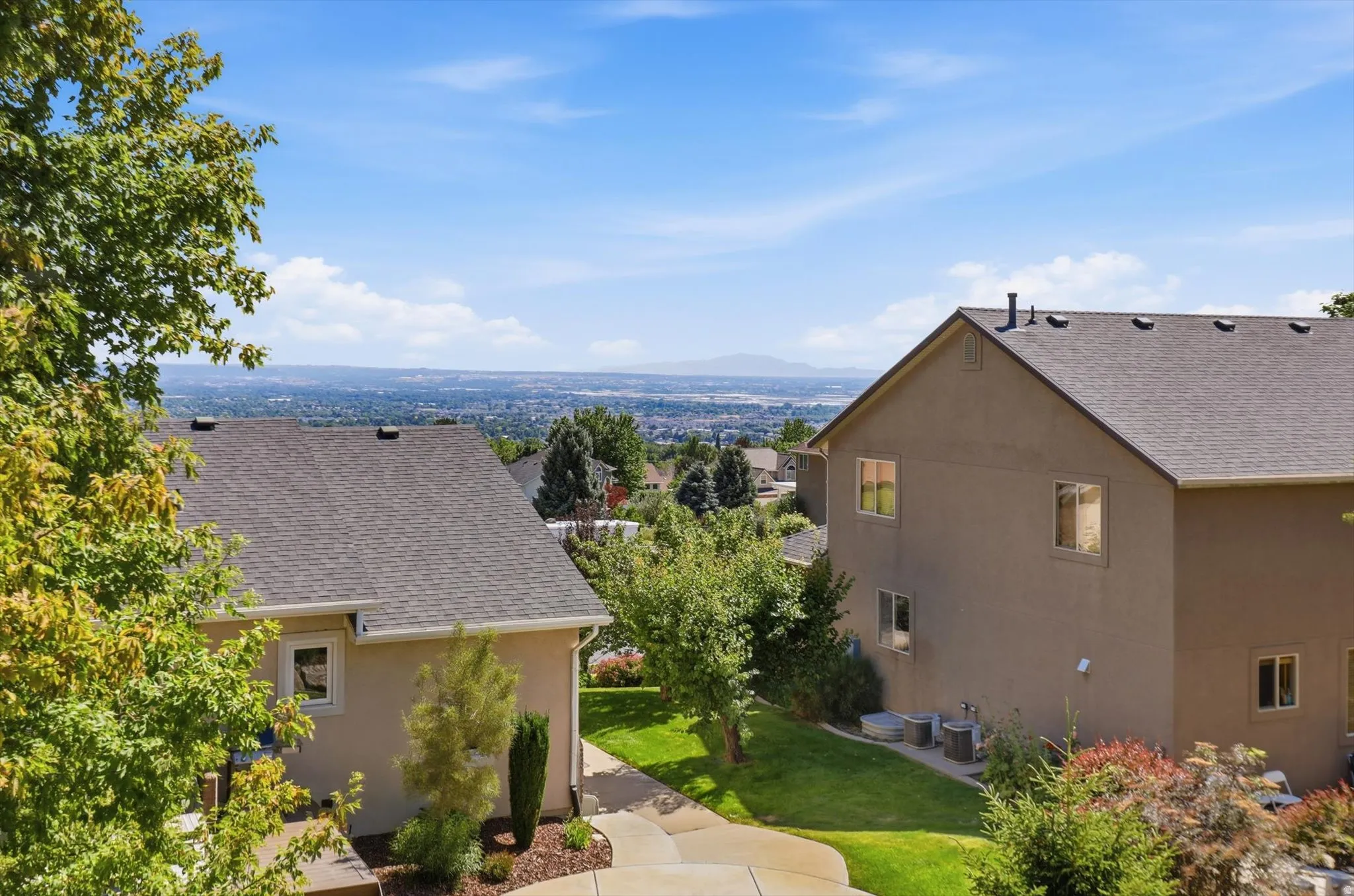 Expansive city-level scenery provides a distant backdrop to the property