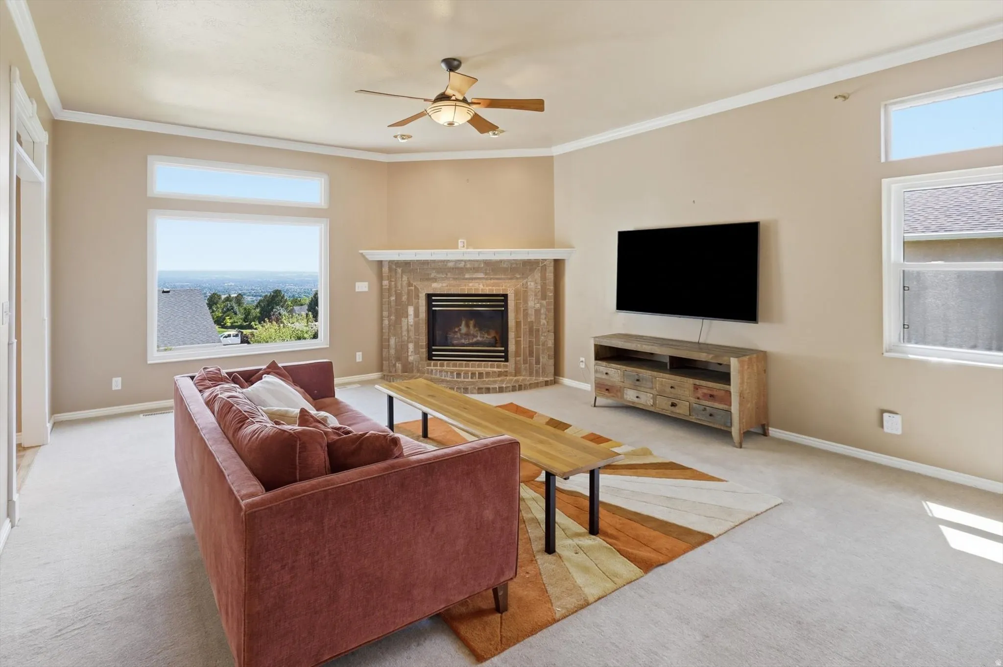 Living area with large windows providing distant landscape views