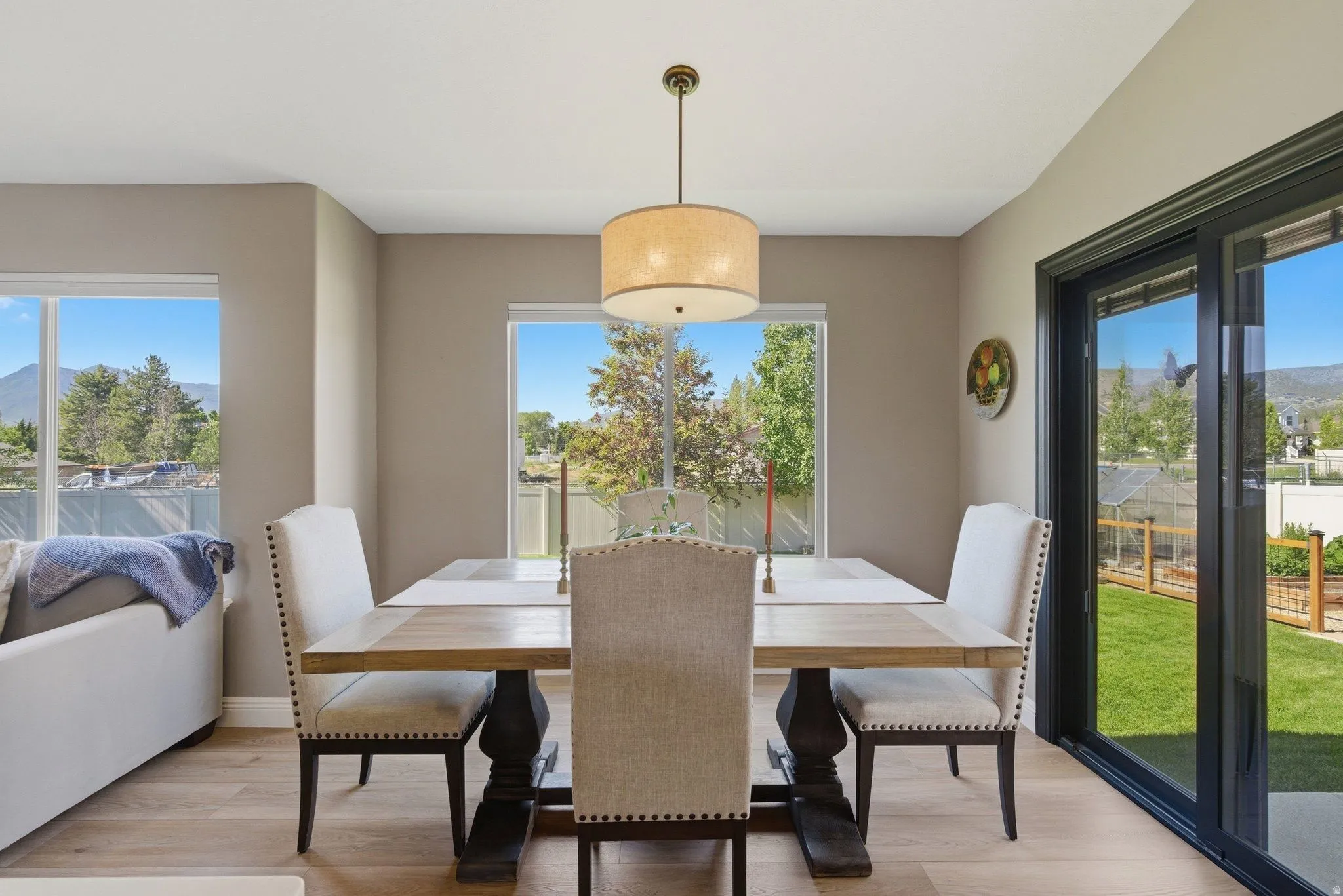 Dining area featuring neutral wall tones and wood-finish flooring