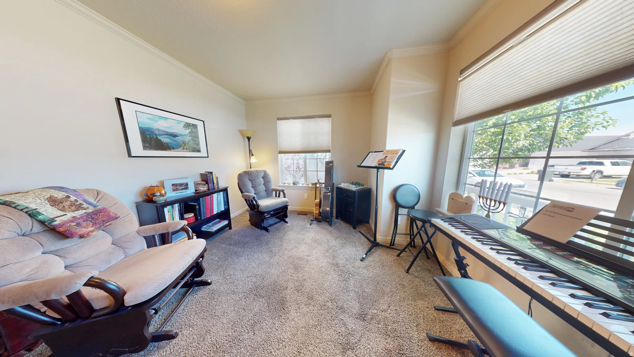 Interior living space featuring light-colored walls and crown molding