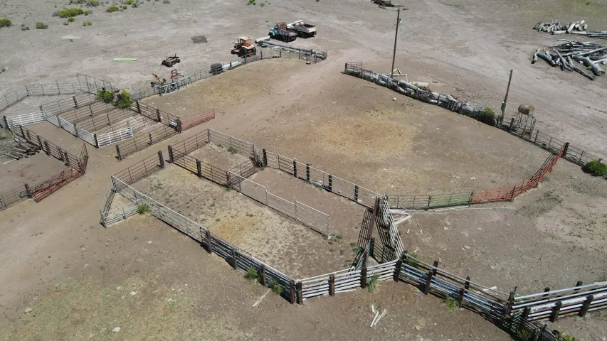 Extensive corrals and fencing systems across a large, open terrain