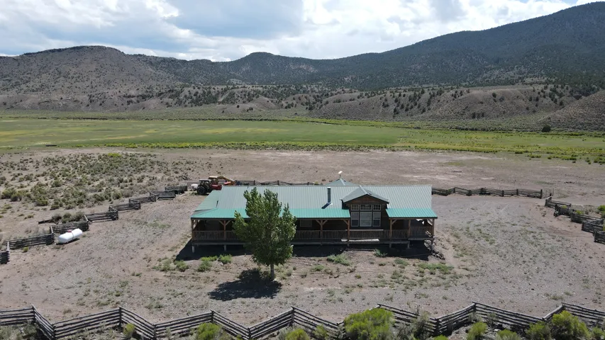 Ranch-style residence featuring a metal roof and an extended covered porch