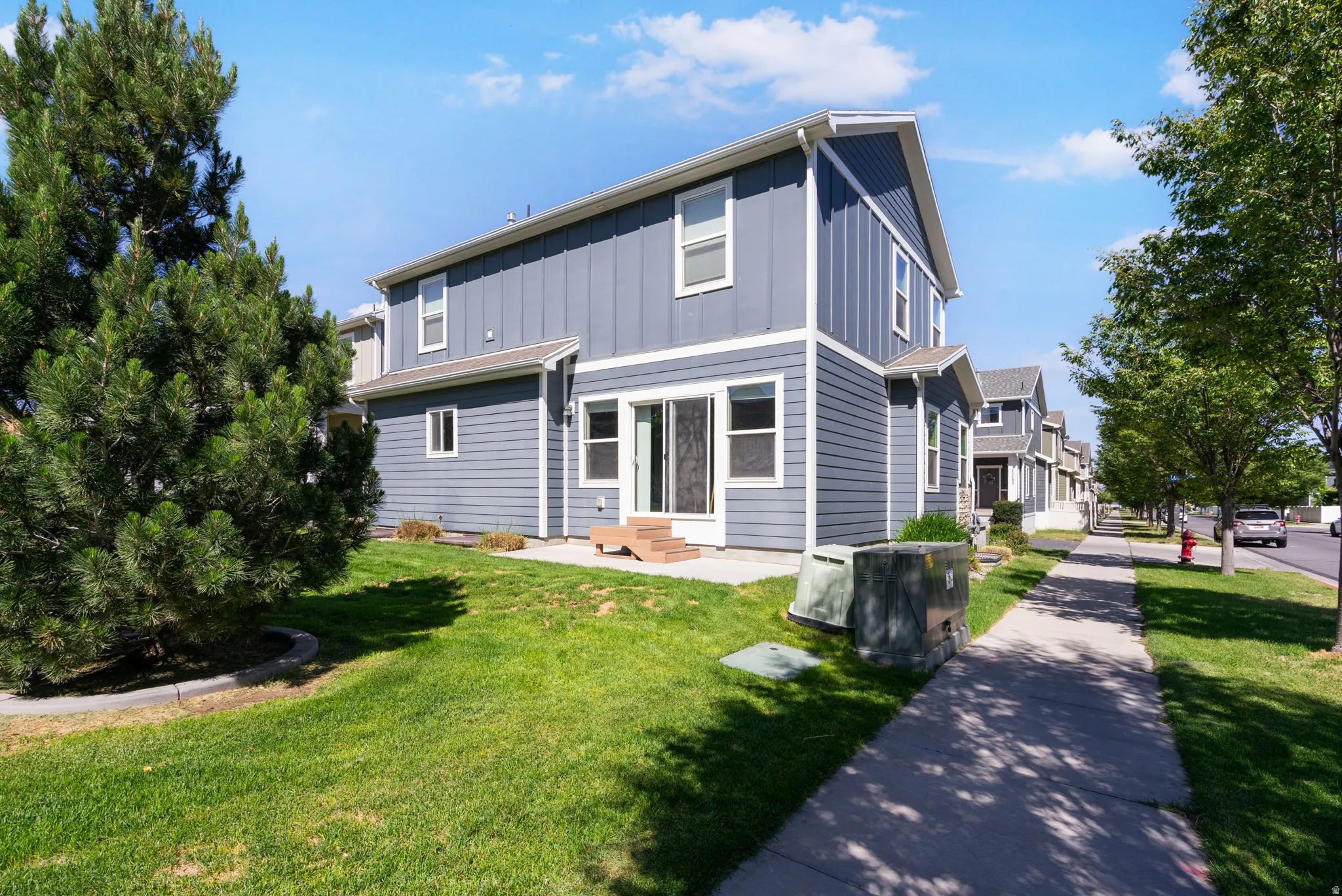 Two-story exterior with blue siding and white trim