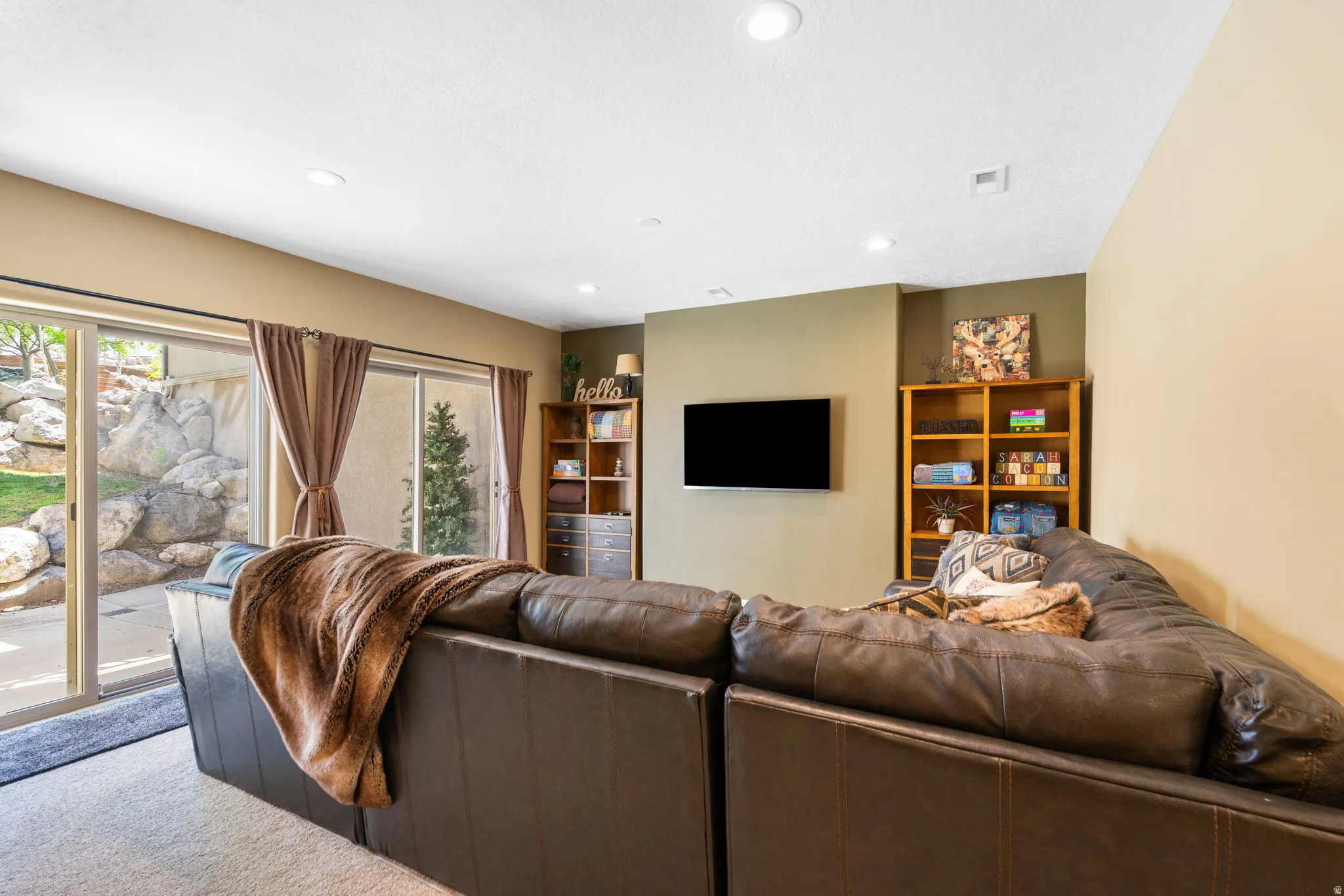Basement family area off the game area with daylight basement walk out entrance perfect to get to the pool!