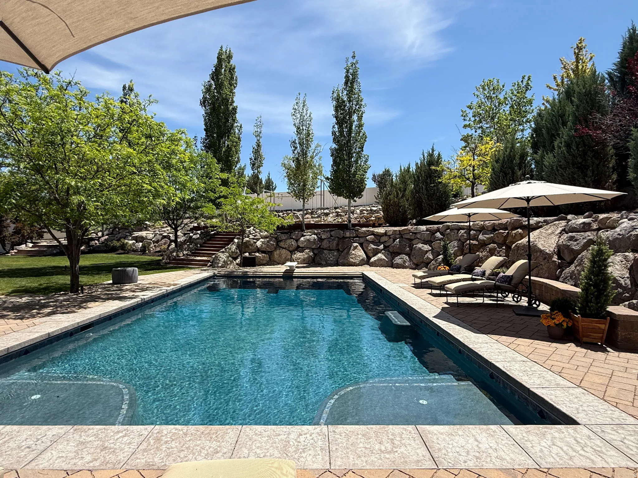 Swimming pool with retractable cover.