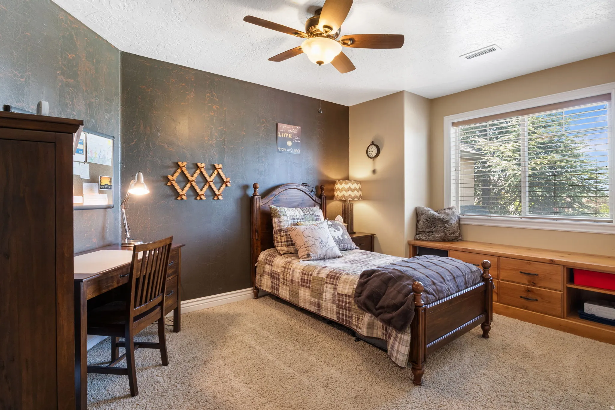 Bedroom 2 featuring a built-in window bench with integrated storage.
