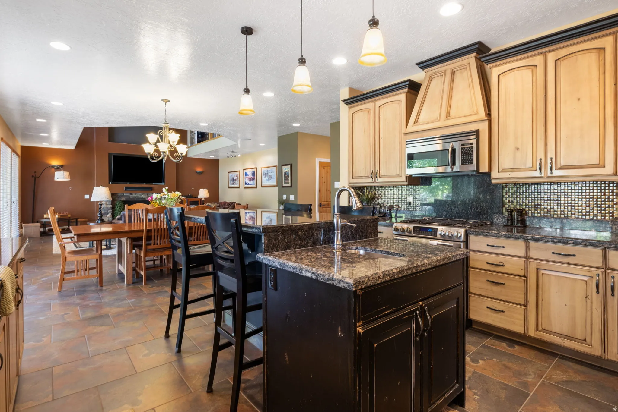 Second prep sink and gas range in this gourmet kitchen