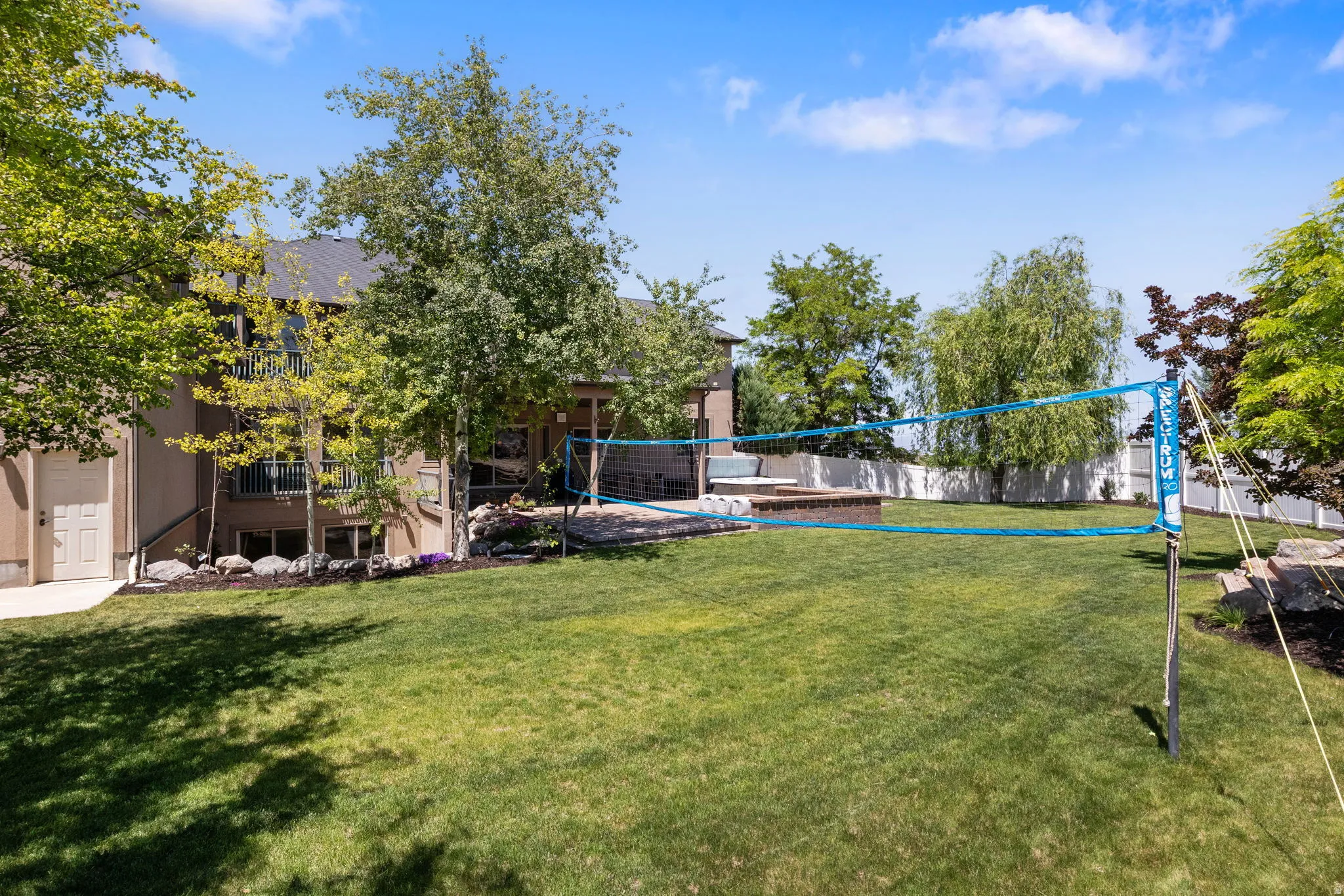 Open flat grass area large enough for full size volleyball net.
