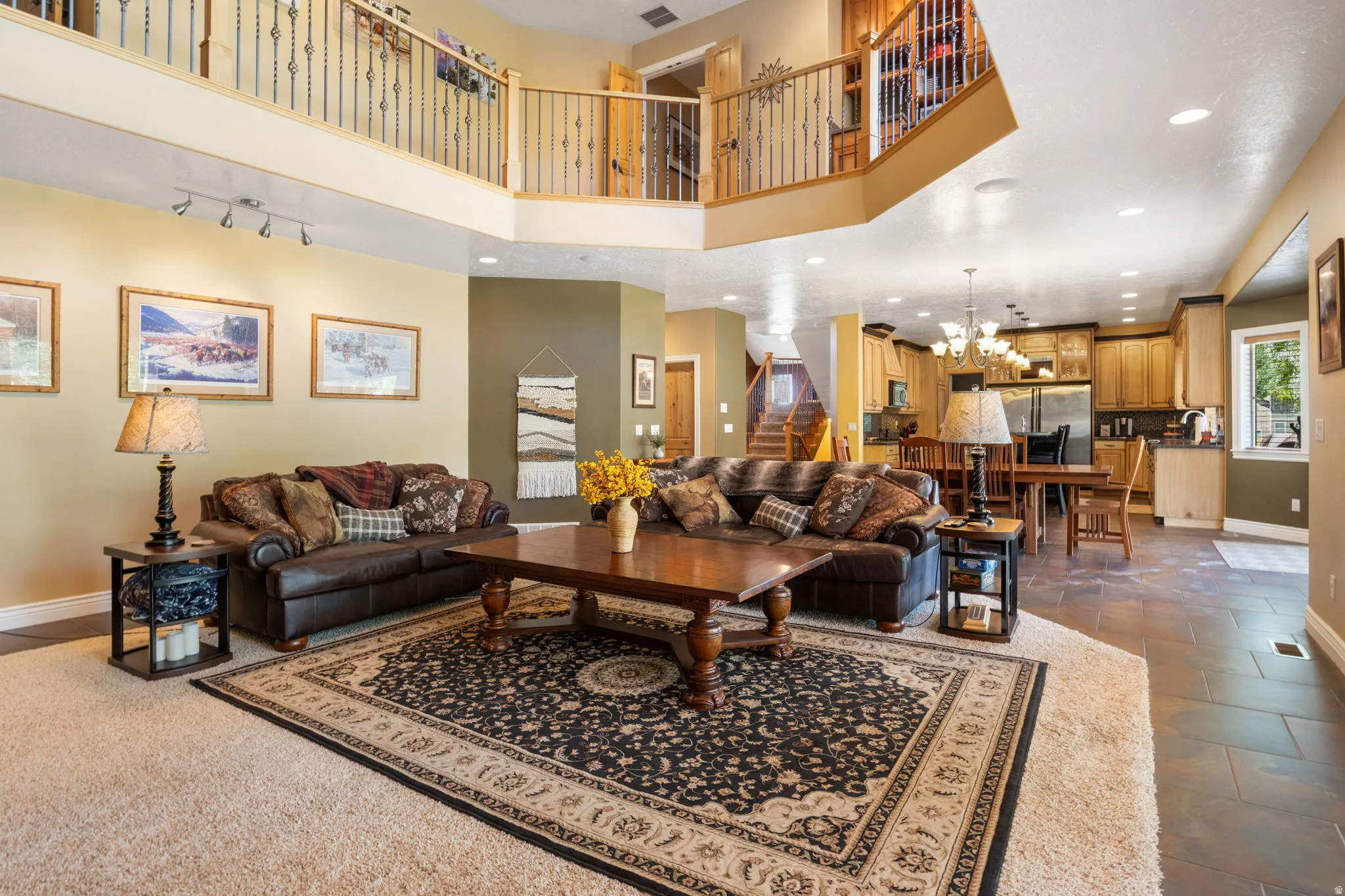 2 story family room with cat walk above